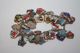 A SILVER AND ENAMEL CHARM BRACELET