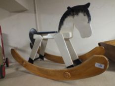 A MODERN WOODEN ROCKING HORSE