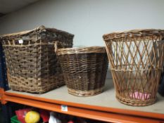 A WICKER LOG BASKET TOGETHER WITH TWO OTHERS