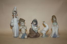 A COLLECTION OF FIVE LLADRO FIGURES TO INCLUDE A GIRL WITH A SHEEP, GOOSE FIGURE ETC.