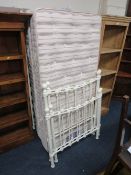 A PAIR OF VICTORIAN STYLE METAL SINGLE BED FRAMES WITH SLEEPWELL MATTRESSES