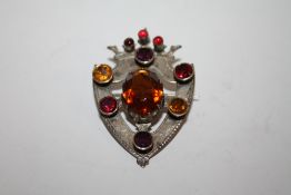 A SCOTTISH STYLE WHITE METAL MULTI GEM SHIELD SHAPED BROOCH
