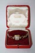 A LADIES 9 CT GOLD ROMA WRISTWATCH IN ORIGINAL BOX