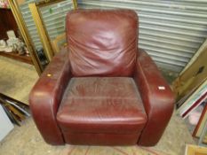 A LARGE MODERN LEATHER ARMCHAIR