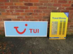 A LARGE ACRYLIC TUI ADVERTISING SHOP SIGN TOGETHER WITH A DIGITAL EXCHANGE RATE DISPLAY BOARD