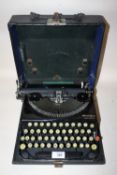 A VINTAGE REMINGTON POTABLE TYPEWRITER