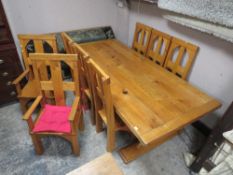 A LARGE AND IMPRESSIVE GOLDEN OAK REFECTORY TABLE AND EIGHT GOTHIC STYLE HIGH BACK CHAIRS - TABLE