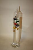 A GLASS GALILEO THERMOMETER, HEIGHT 34 CM