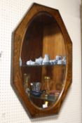 A VINTAGE OAK FRAMED HEXAGONAL BEVEL EDGED WALL MIRROR, OVERALL SIZE 86 CM X 61 CM