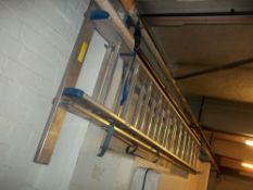 A TWELVE RUNG ALUMINIUM EXTENDING LADDER