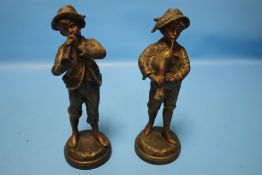 A PAIR OF ANTIQUE SPELTER FIGURES OF BOYS SIGNED 