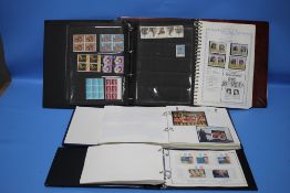 FOUR ALBUMS OF MINT STAMPS, CHANNEL ISLANDS, OTHER ISLANDS