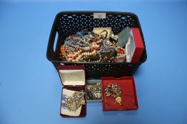 A BASKET OF COSTUME JEWELLERY