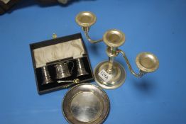 A HALLMARKED SILVER SMALL DISH, HALLMARKED CONDIMENT SET IN CASE AND A PLATED CANDLE HOLDER