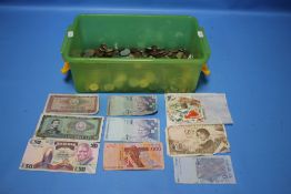 A BOX OF COINS AND BANKNOTES