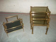 A BRASS MAGAZINE RACK AND A BRASS NEST OF TABLES