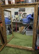A LARGE REPRODUCTION GILT FRAMED MIRROR
