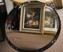 A CIRCULAR FRAMED MIRROR DIAMETER 80 CM