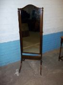 AN ANTIQUE SWIVEL DRESSING MIRROR FULL LENGTH ON WHEELS