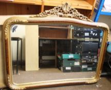 A DECORATIVE FRAMED MIRROR, 110 X 128 CM