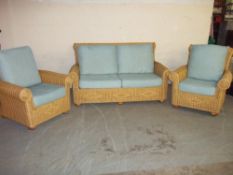 A WICKER THREE PIECE SUITE
