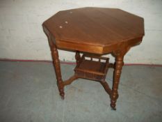 AN ANTIQUE OCTAGONAL EDWARDIAN STYLE TABLE WITH GALLERIED UNDERSHELF AND CASTORS