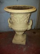 AN ANTIQUE CAST IRON GARDEN URN / PLANTER