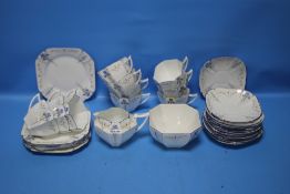 AN ART DECO SHELLEY TEASET DECORATED WITH BLUE FLOWERS, A BIT WORN