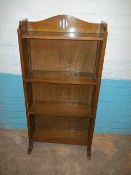 AN ANTIQUE SOLID OAK BOOKSHELF