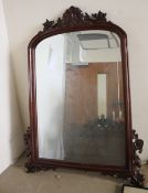 A WOOD FRAMED MIRROR 110 X 78CM