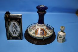 TWO NAVAL ITEMS TO INCLUDE PUSSERS RUM BOTTLE AND STOPPER COMMEMORATING HMS VICTORY TRAFALGAR 1805