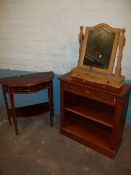 A SERPENTINE FRONTED HALL TABLE, A SMALL BOOKSHELF AND A PINE SWING MIRROR