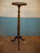 AN ANTIQUE TORCHERE PLANT STAND