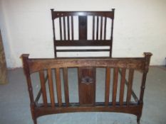 AN ANTIQUE OAK VONO DOUBLE BEDSTEAD FRAME