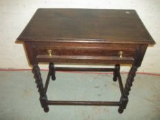 AN ANTIQUE OAK HALL TABLE WITH DRAWER AND BARLEY TWIST LEGS