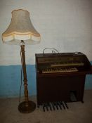 A GEM FLOOR STANDING ORGAN AND A SOLD WOOD FLOOR STANDING STANDARD LAMP