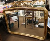 A LARGE REPRODUCTION GILT FRAMED MIRROR