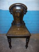 AN ANTIQUE HALL CHAIR