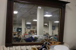 A SMALL MAHOGANY FRAMED OVERMANTEL STYLE MIRROR