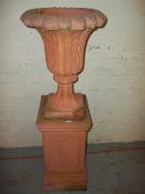 A TERRACOTTA TYPE CONCRETE GARDEN PLANTER / URN AND PEDESTAL¦++SLIGHT DAMAGE TO CORNER¦