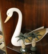 A CARVED WOOD HARRODS SWAN ALONG WITH A PAIR OF NOVELTY PALM TREE CANDLESTICKS