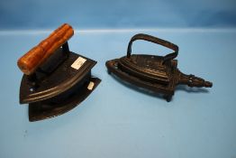 TWO VINTAGE FLAT IRONS