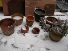 A SELECTION OF TERRACOTTA AND CONCRETE PLANTERS