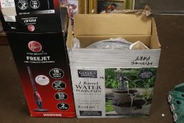 A BOXED TWO BARREL WATER FOUNTAIN AND A BOXED HOOVER FREEJET