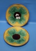 A PAIR OF MAJOLICA PLATES, ONE A/F