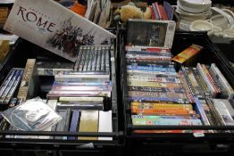 TWO TRAYS OF DVDS AND CDS TO INCLUDE LORD OF THE RINGS AND A SET OF 