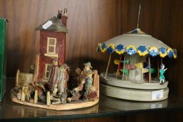 AN ART POTTERY CAROUSEL AND A FIGURE GROUP