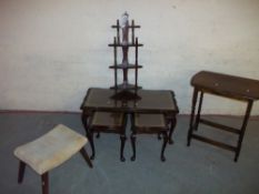 A LEATHER INLAID NEST OF TABLES COMPRISING COFFEE TABLES WITH TWO MATCHING SIDE TABLES, A SMALL