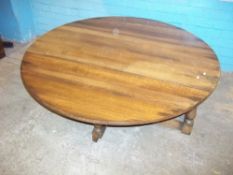 A LOW OAK DROP LEAF COFFEE TABLE