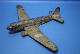 A VINTAGE CAST ALUMINIUM MODEL OF AN AIRCRAFT